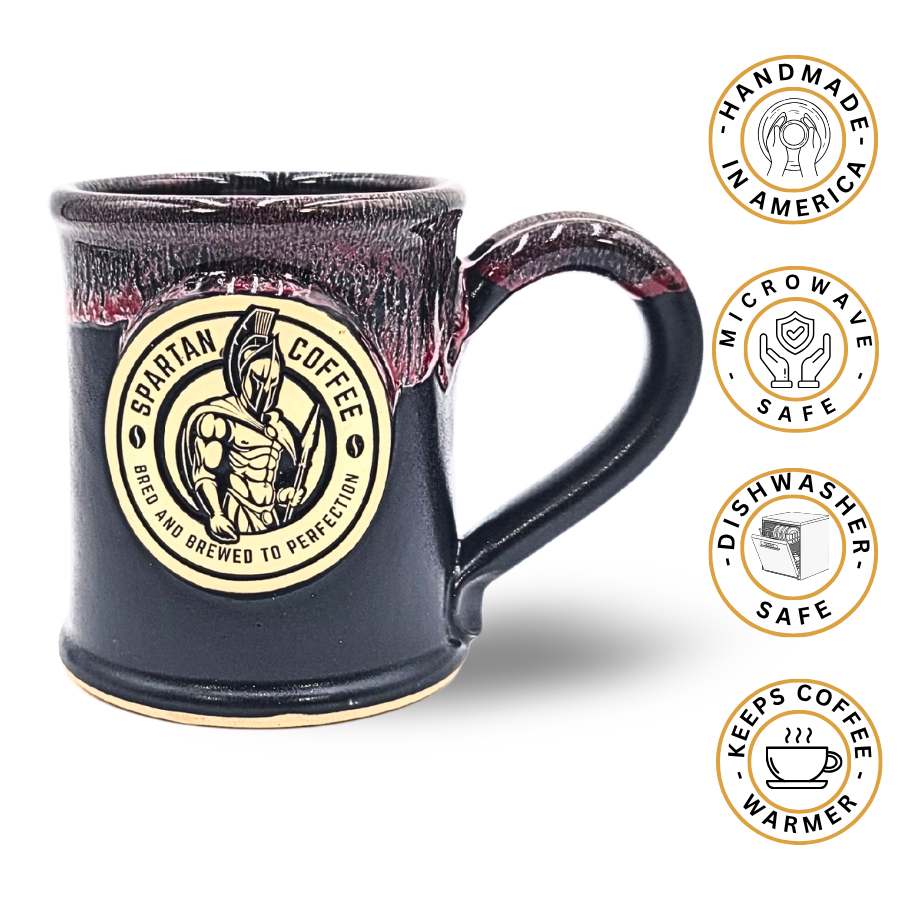 Black mug with Spartan Coffee logo and safety features on a white background